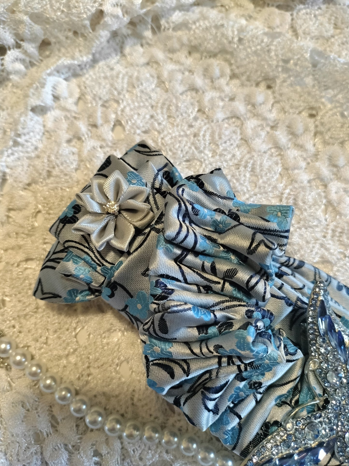 Elegant Blue Floral Tie with Rhinestone Butterfly Brooch