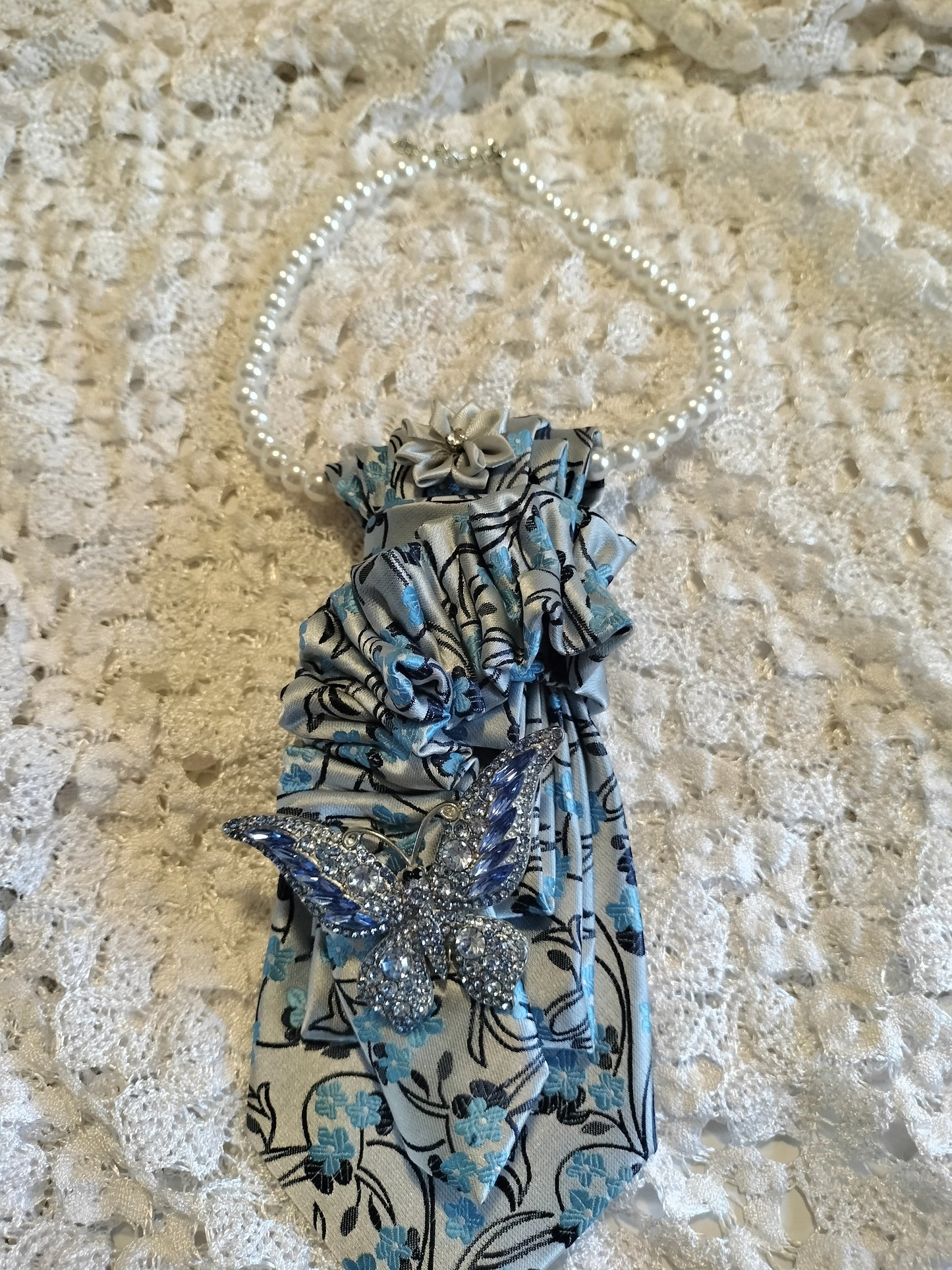 Elegant Blue Floral Tie with Rhinestone Butterfly Brooch