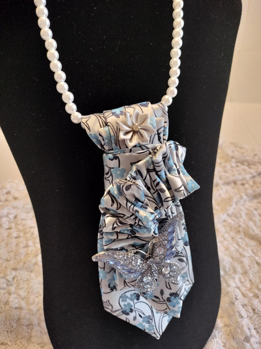 Elegant Blue Floral Tie with Rhinestone Butterfly Brooch