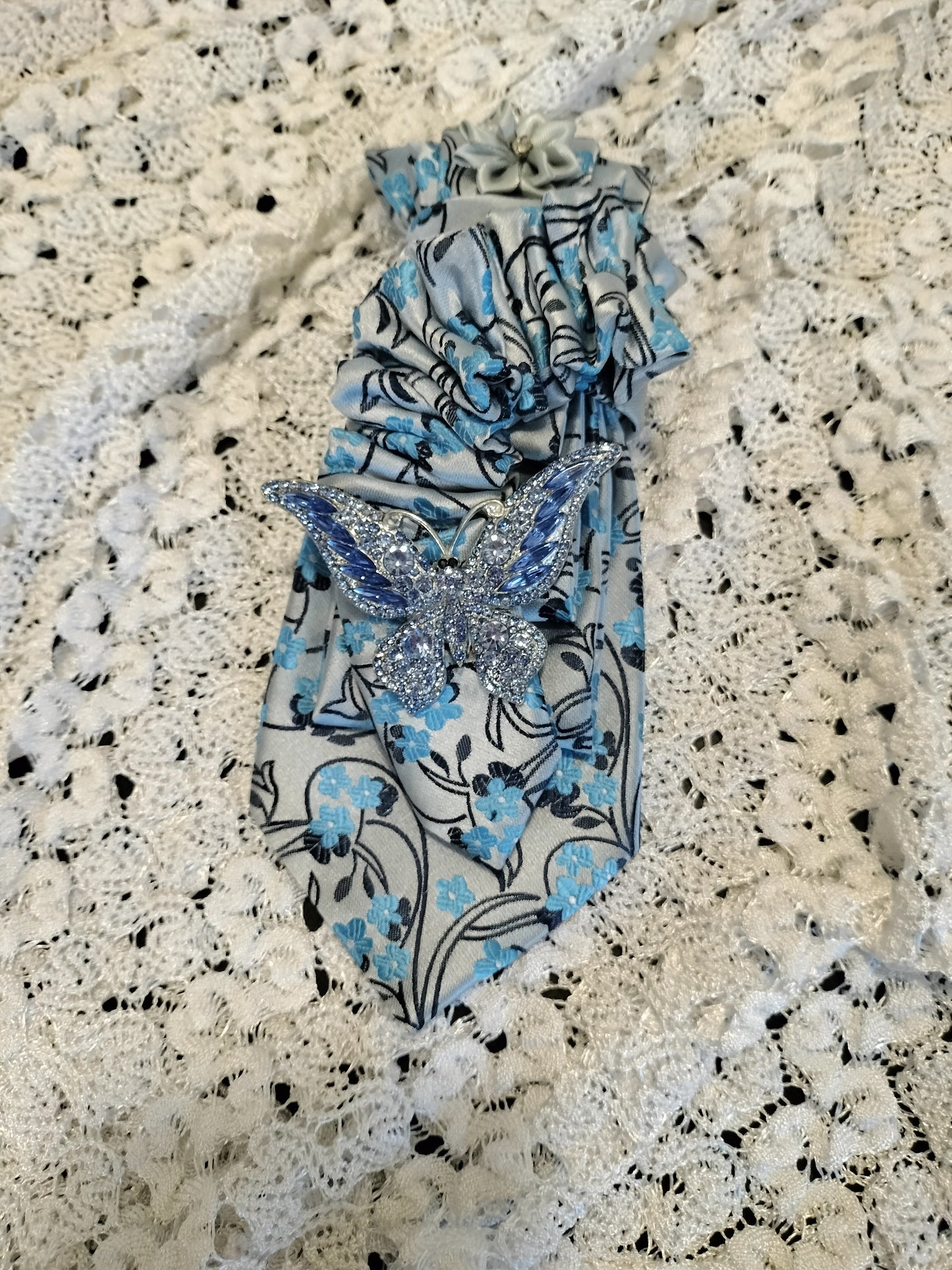 Elegant Blue Floral Tie with Rhinestone Butterfly Brooch