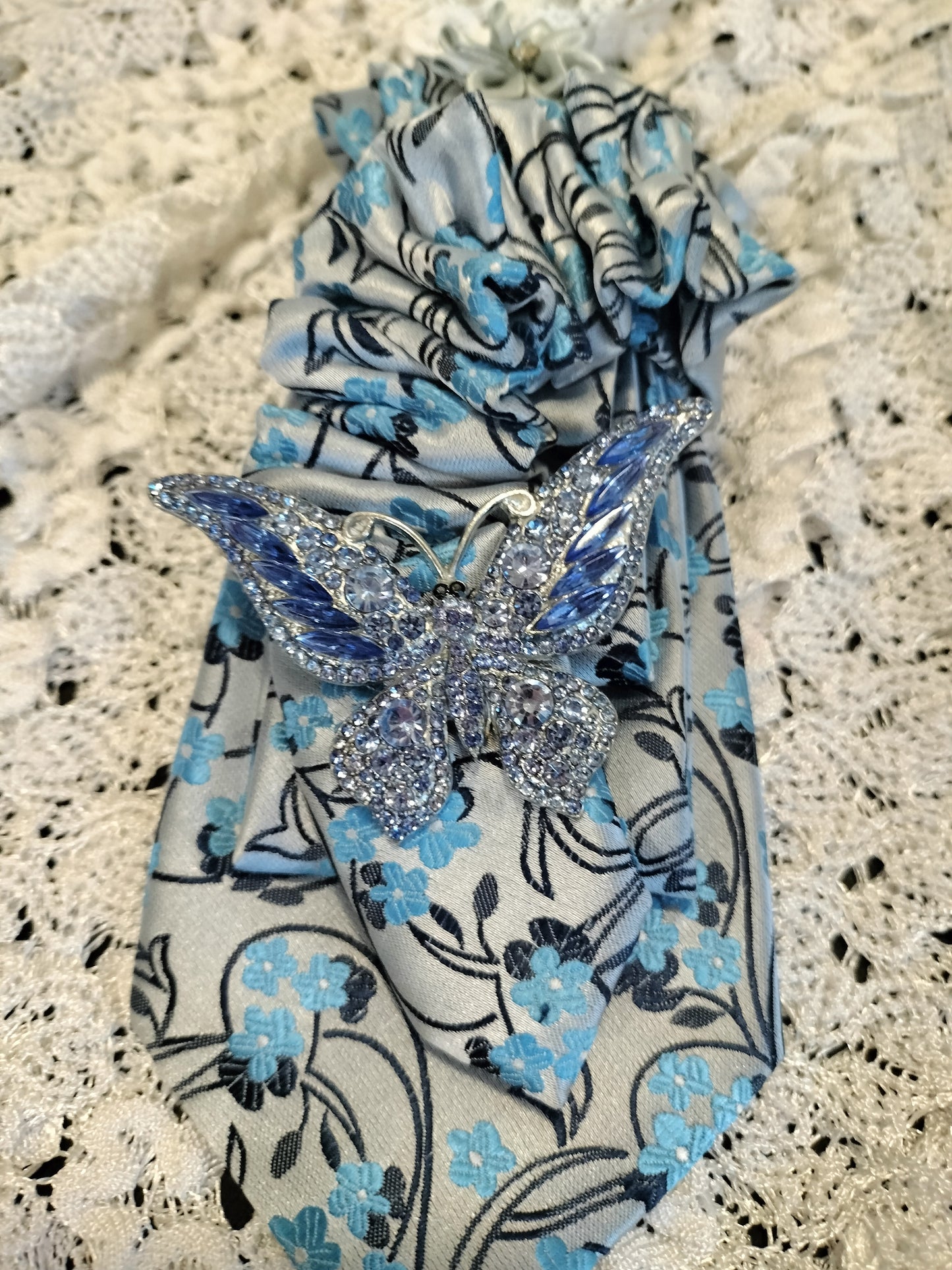 Elegant Blue Floral Tie with Rhinestone Butterfly Brooch