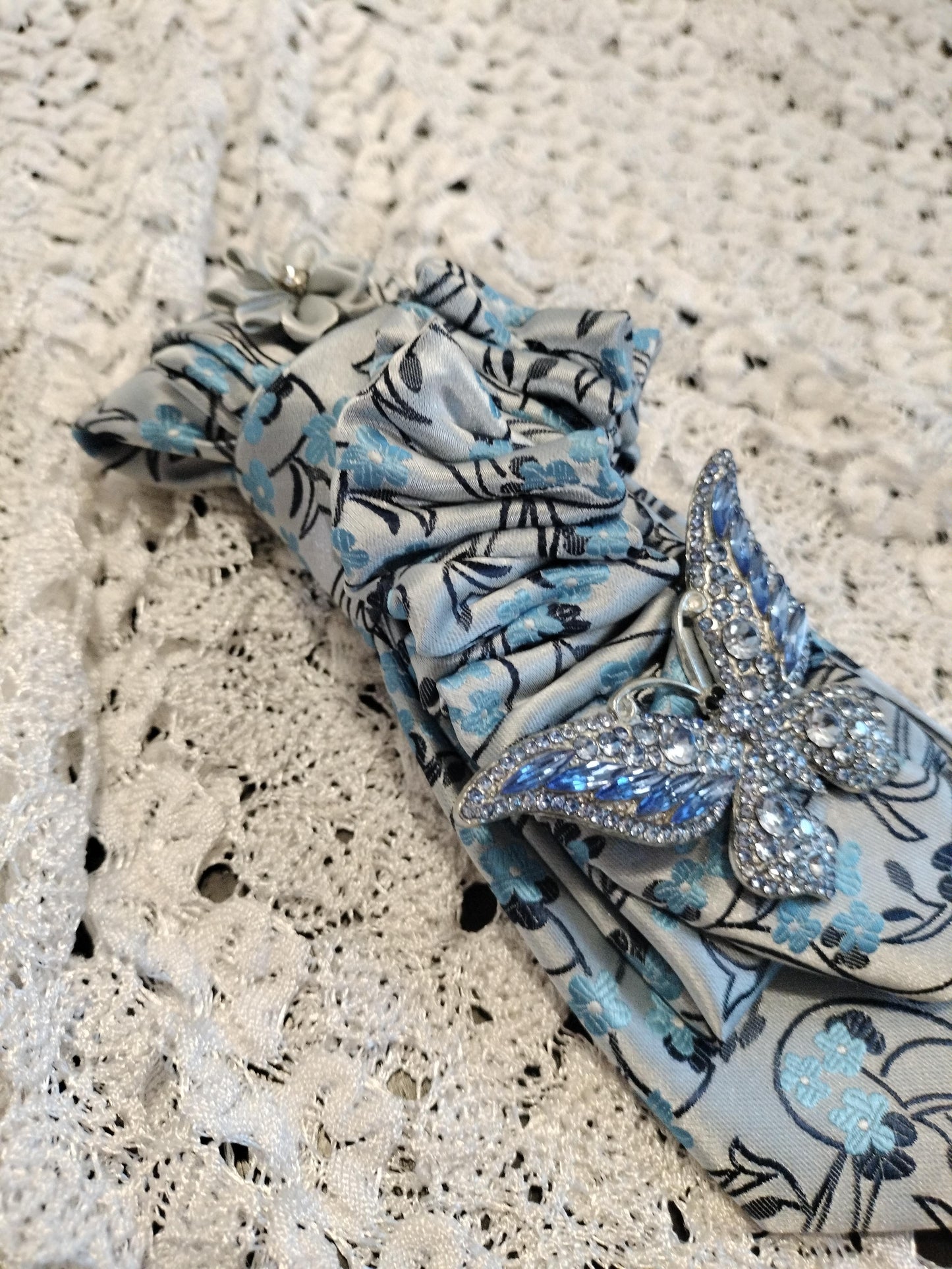 Elegant Blue Floral Tie with Rhinestone Butterfly Brooch